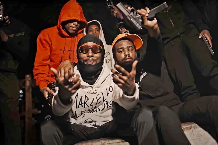 Abdul Vicks, left, and Mark Johnson, right, rap in a song called "Bumblebee Gang" filmed by DJBey215. Johnson was one of 19 people indicted last month.