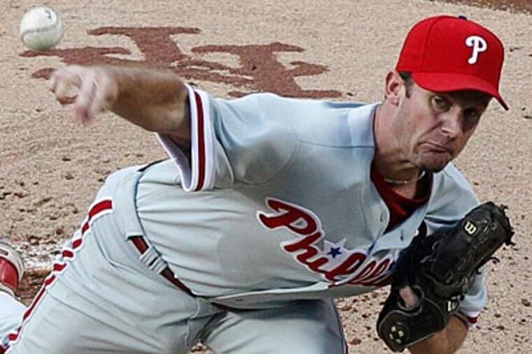 Roy Oswalt pitched six innings and allowed two runs, one earned, against the Mets on Friday. (Frank Franklin II/AP Photo)
