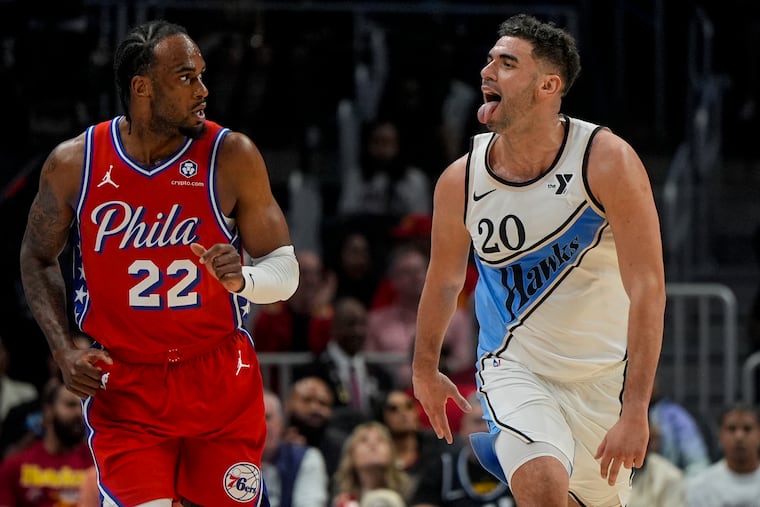 Atlanta Hawks forward Georges Niang (20) celebrates his three-point shot against the Philadelphia 76ers during the first half of an NBA basketball game, Sunday, March 23, 2025, in Atlanta.