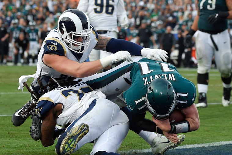 The Eagles have won six in a row against the Rams, including in L.A. in 2017. He's shown here scoring on a QB keeper, in which he tore his ACL. The touchdown was called back because of a penalty, but Wentz remained in the game. Four plays later he threw a touchdown pass. That was his last pass of that season. Nick Foles came in and led the team to the Super Bowl.