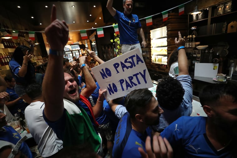 Fans celebrate in Caffe L'Aquila in Philadelphia, Pa. on July 6, 2021 after Italy beats Spain.