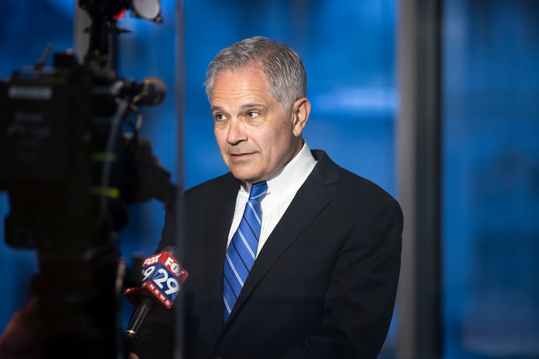 District Attorney Larry Krasner speaks with a reporter during his election night party in May 2025/