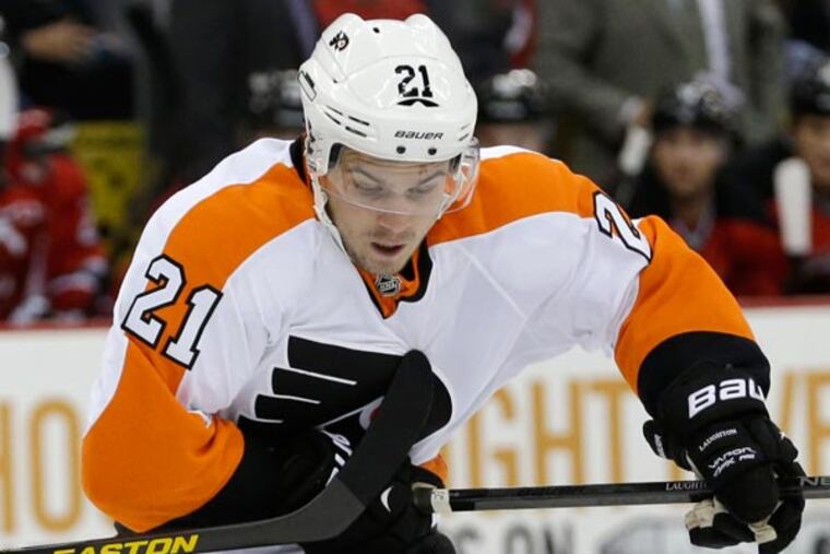 Scott Laughton (21) skates against New Jersey Devils defenseman Marek Zidlicky (2) during the first period of an NHL hockey game, Thursday, Sept. 26, 2013, in Newark, N.J. (Julio Cortez/AP)
