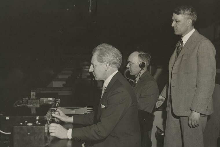 Leopold Stokowski (left) with Dr. Harvey Fletcher (right) at the Academy of Music, photograph by Bell Telephone Laboratories, Inc. (1933).