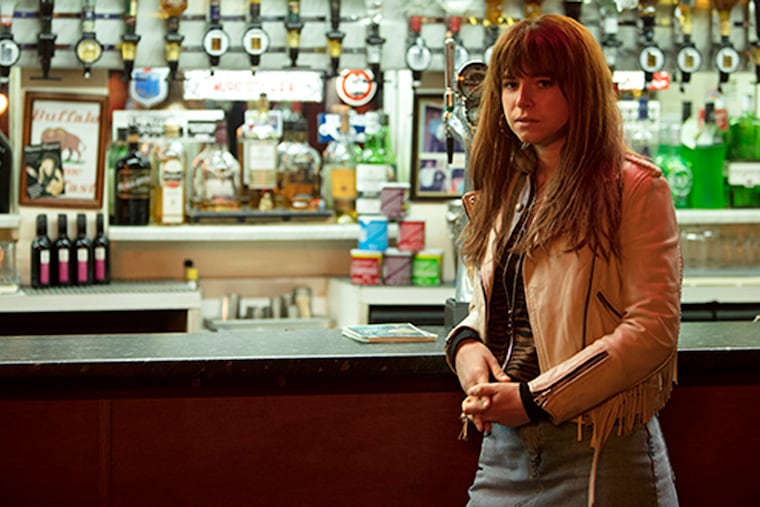 This image released by Neon shows actress Jessie Buckley in a scene from the film, "Wild Rose." Buckley stars as a fiery, working-class Glasgow single mother, just out of prison, who dreams of becoming a country music star. (Neon via AP)