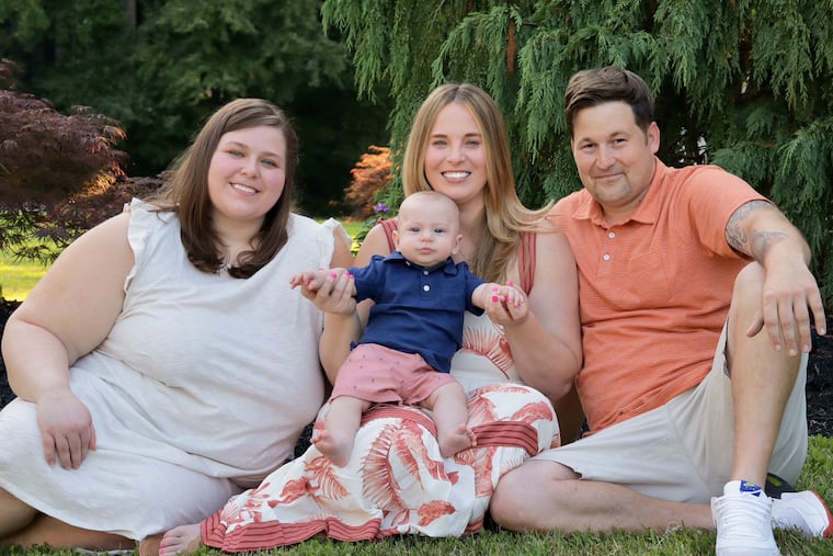 Whelan/Wurster family. From left: Kaeley, Kelly (holding Jack) and Adam.