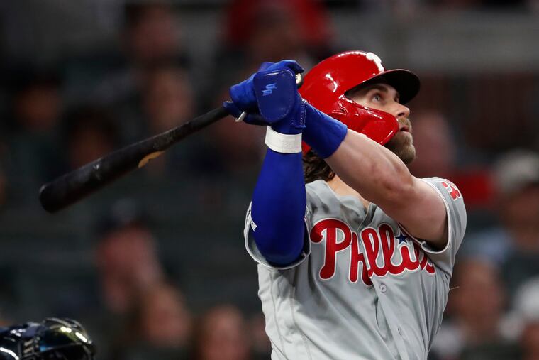 Phillies right fielder Bryce Harper follows through on his two-run home run in the fourth inning.