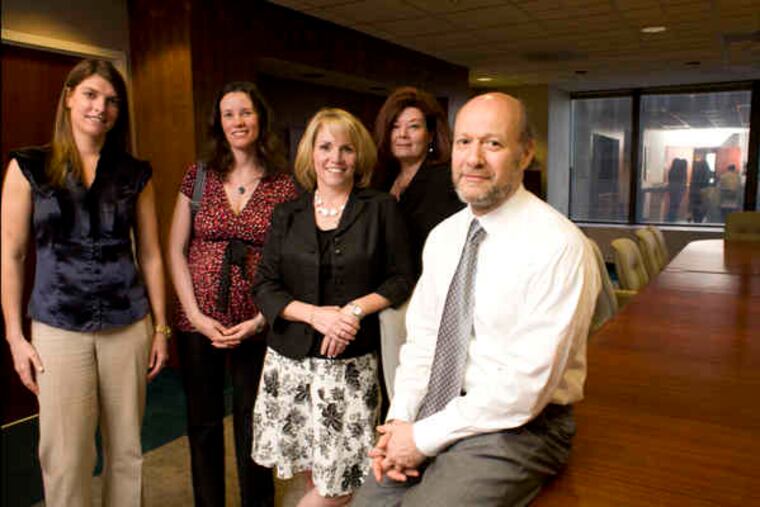 At APF Properties headquarters at 1601 Market St. , Berndt Perl (right) owner, with members of his Philadelphia design team (from left) Claire Belford, Jessica Kavanagh, Missy Quinn, and Theresa McCaul-Mullan.