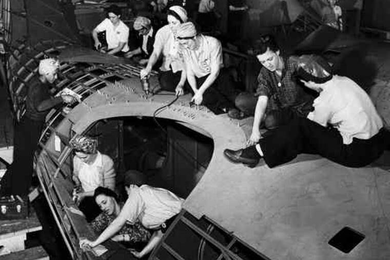 Women riveting a turret at the Navy Yard's aircraft factory in 1943. Workers saw more cash than ever before, but rationing meant fewer ways to spend it.
