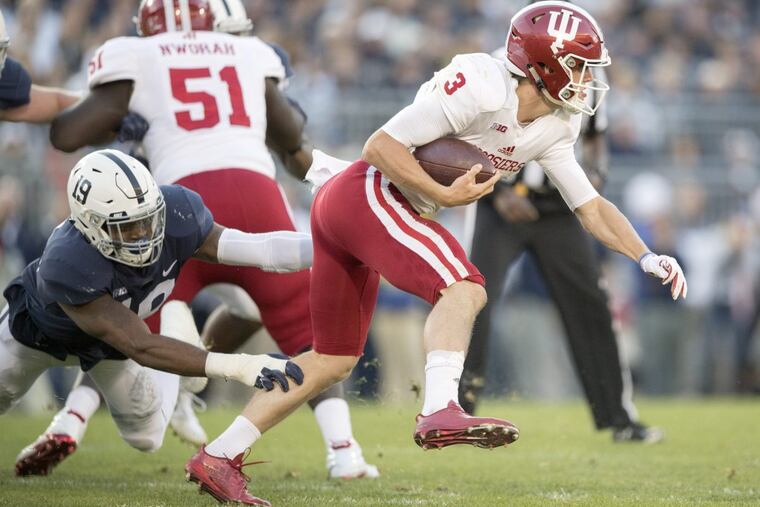 Penn State defensive end Shareef Miller trips up Indiana quarterback Peyton Ramsey.