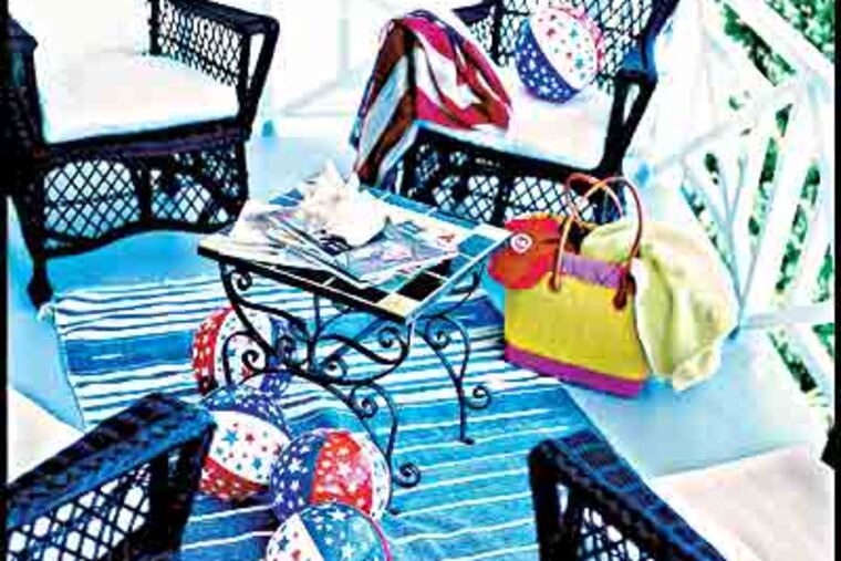 The front porch of Emmerling's bungalow in Laguna Beach, Calif. The chairs are "punctuation," and beach balls add fun. (Carter Berg/ "Mary Emmerling's Beach Cottages")