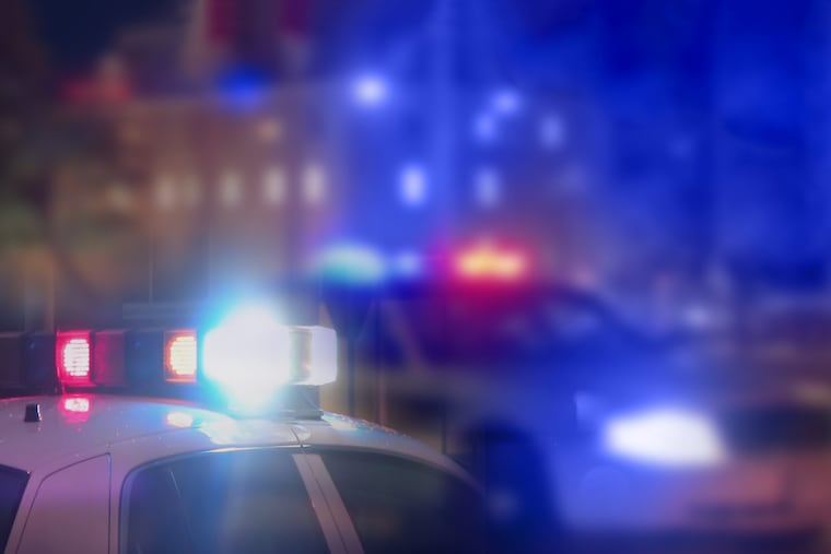 Blurred police vehicles.