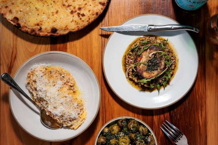 The Pane Di Recco, Tajarin pasta, olives and stuffed guinea hen at Luca on Wednesday, April 1, 2026 in Lancaster, Pa.