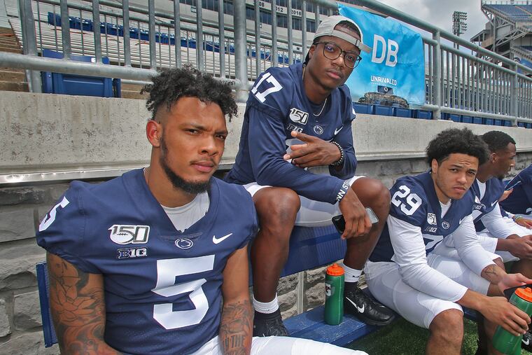 Penn State football defensive backs Tariq Castro-Fields (5), Garrett Taylor (17) and John Reid (29) during the program's annual Media Day on Aug. 3, 2019. CRAIG HOUTZ / For the Inquirer