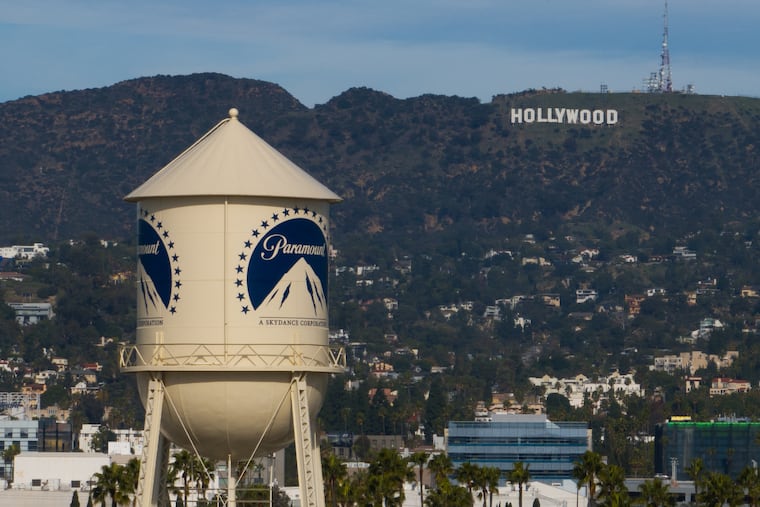 The Paramount water tower is seen in Los Angeles, Dec. 18, 2025, with the Hollywood sign in the distance.