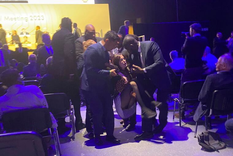 Protesters who tried to storm the stage are taken out of the Excel centre in east London during oil giant Shell's annual general meeting in London on Tuesday.