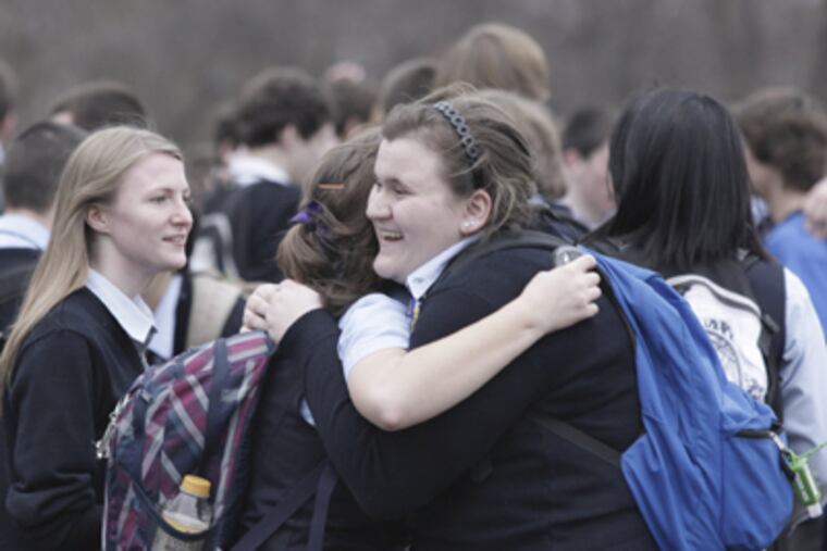 After it was announced that Conwell-Egan Catholic High School would stay open, students, faculty and alumni celebrated. (Elizabeth Robertson / Staff Photographer)