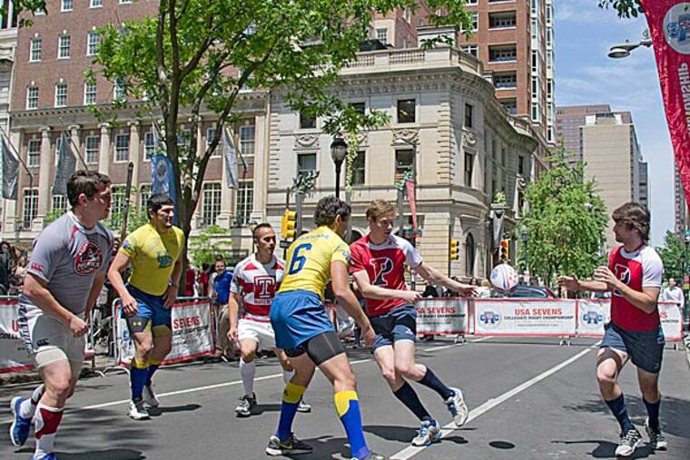 Rugby teams from local colleges gathered in Rittenhouse Square on Tuesday. (Clem Murray/Staff Photographer)
