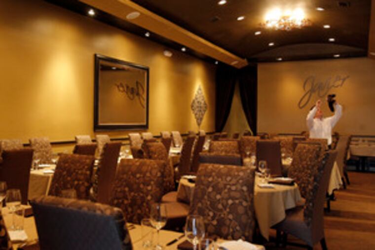 Waiter George Fox prepares for the opening of Javier in Haddonfield, the latest eatery from Robert Sanabria.