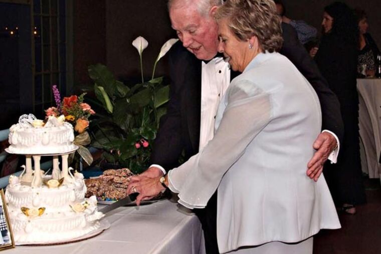 Couple: JACK LEES and PAT PIERSON
Bride & Groom cut the cake at wedding reception. Photo credit: Photography by J. William Citino III