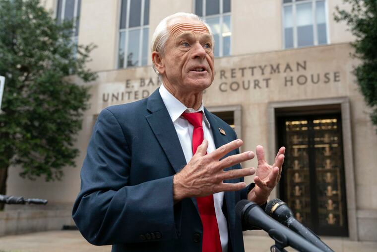 Former Trump White House official Peter Navarro talks to the media as he arrives at U.S. Federal Courthouse in Washington on Thursday.