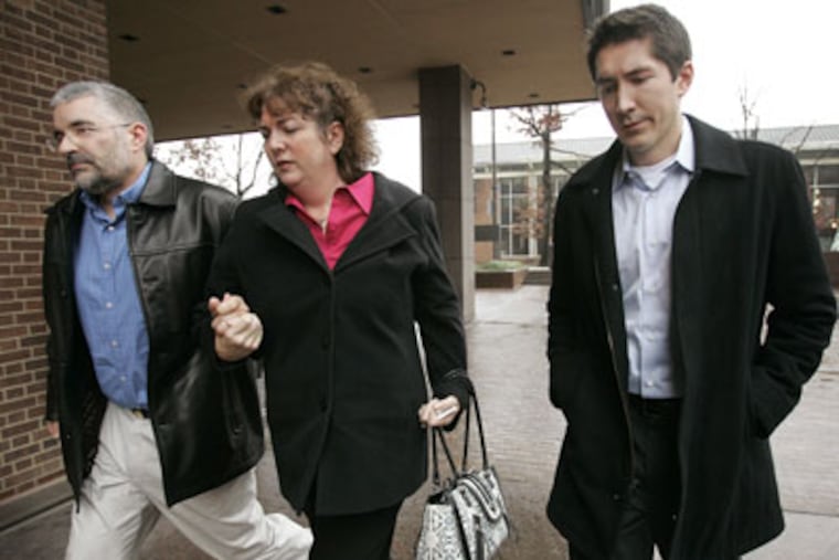 Edward Anderton (right) arrives for his sentencing this afternoon at the U.S. District Courthouse in Philadelphia. He was convicted of fraud after stealing the identities of friends and neighbors to support a lavish lifestyle. (Alejandro A. Alvarez / Staff Photographer)