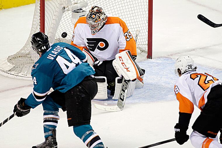 Sharks defenseman Marc-Edouard Vlasic scores past Flyers goalie Steve Mason. (Marcio Jose Sanchez/AP)
