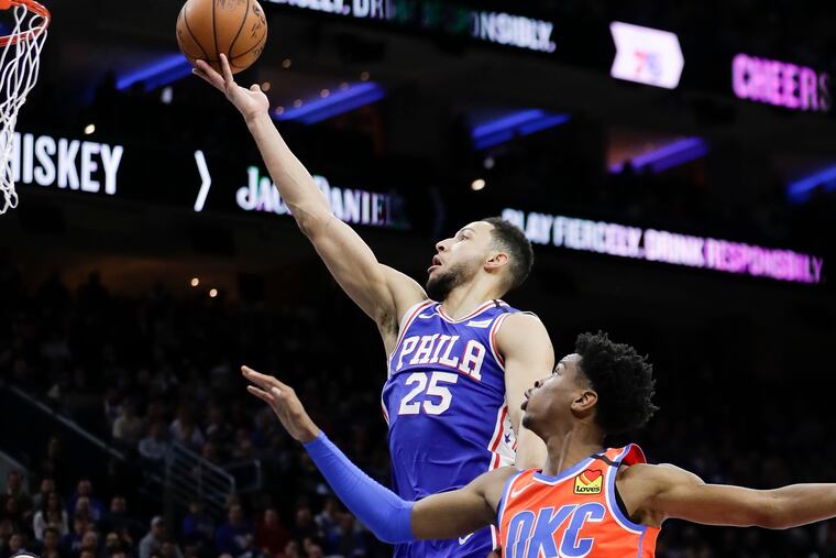 Sixers guard Ben Simmons lays up the basketball past Thunder guard Shai Gilgeous-Alexander during the second half.