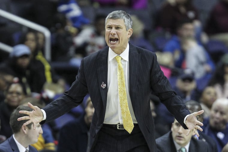 LaSalle's head coach Dr. John Giannini calls plays against UMass during the 2nd half of the A-10 tournament, first round, at the Capital One Arena, in Washington, DC, Wednesday, March 7, 2018. Umass beats LaSalle 69-67 to advance in the A-10 Tournament. STEVEN M. FALK / Staff Photographer