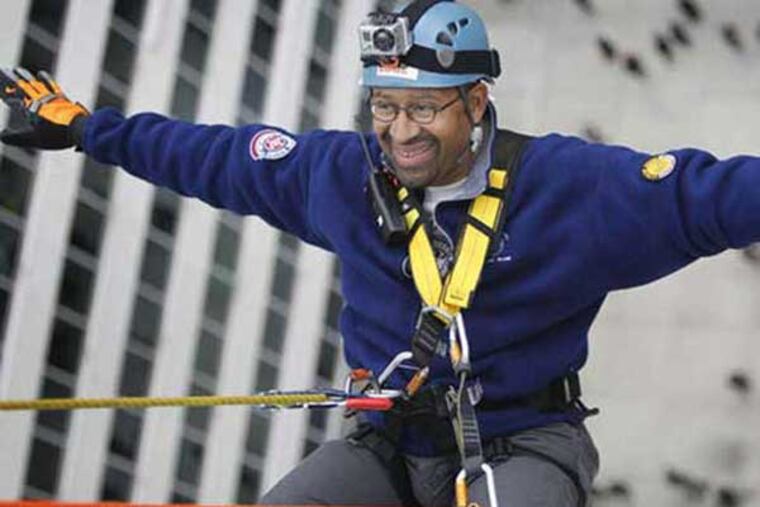 Mayor Nutter rappelling down a 21-story building on Market Street.
