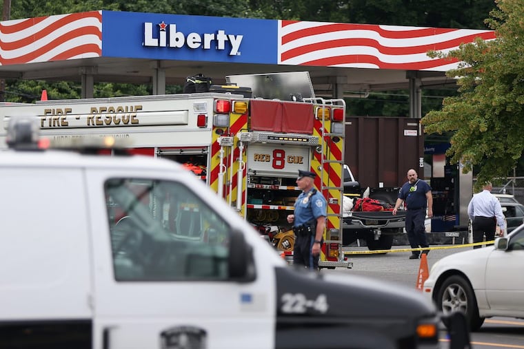 Emergency responders work to recover the body of a man trapped in an underground chamber after an explosion Tuesday rocked a gas station in Bensalem, Pa., on Wednesday, June 13, 2018. The explosion also left one person in critical condition.