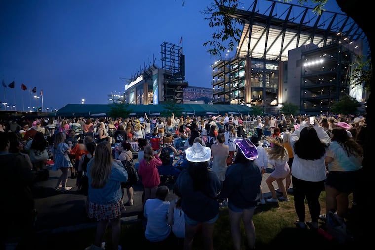 Taylor Swift fans danced in the street after police closed South 11th Street between Lincoln Financial Field and the Wells Fargo Center allowing fans who didn’t have tickets to still enjoy the Taylor Swift concert at Lincoln Financial Field on May 13.