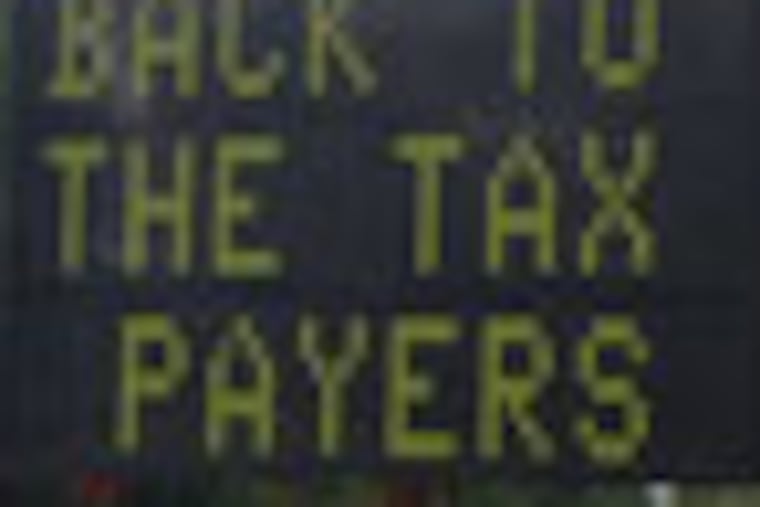 CAPTION: This is part of a message that flashed to drivers in Piscataway on the road outside of a Gov. Christie town hall meeting Tuesday. The Democratic mayor there used the electronic traffic signs to criticize the Republican governor.