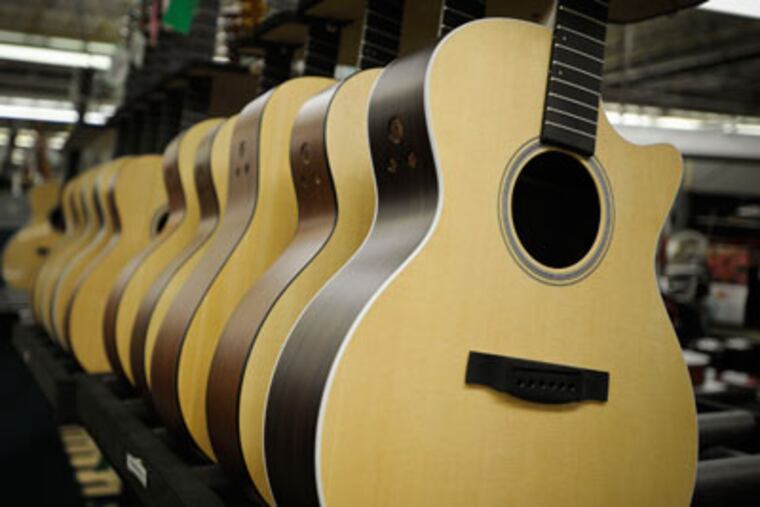 Rows of half finished Martin guitars sit in racks on the factory floor in the Martin Guitar factory in Nazareth, Pa. (Ron Tarver / Staff Photographer)