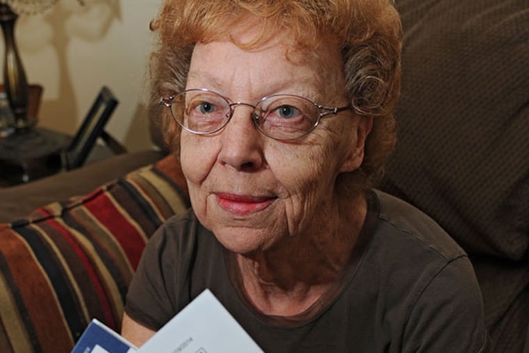 Delores Cantz, 82, holds bills and notices from an ambulance company that wants to charge her $500 after a good Samaritan called for an ambulance when she took a fall dancing at a family party. ( CLEM MURRAY / Staff Photographer )