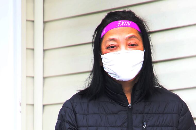 Liu "Sing" Ruixing, 60, a table games dealer at Borgata Casino Hotel and Spa, at home Sunday. She is recovering from COVID-19 after having traveled to Singapore and Nevada before returning to work in March.