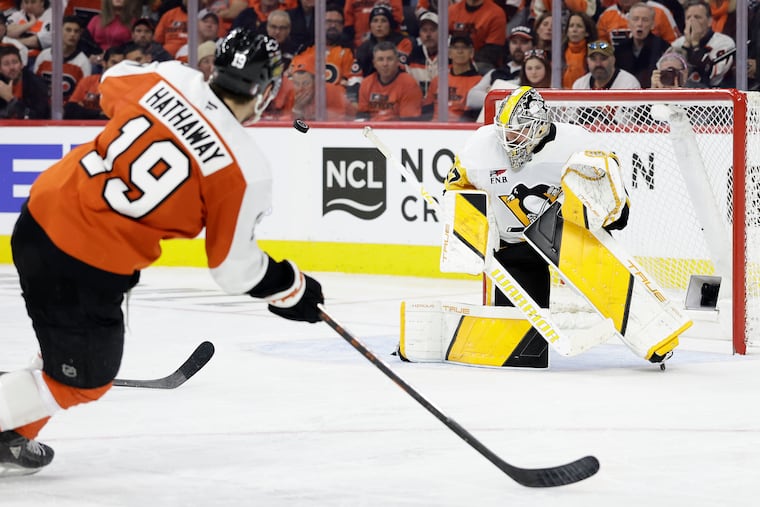 Penguins goaltender Arturs Silovs stops the puck against the Flyers' Garnet Hathaway in Game 4. The Flyers broke through for two goals on Silovs.