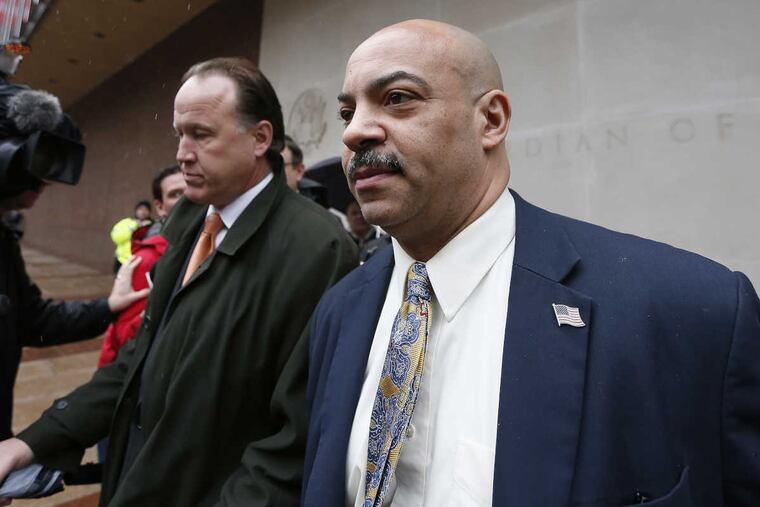 District attorney Seth Williams (right) and his new attorney,Thomas Burkem exit federal court on Friday.