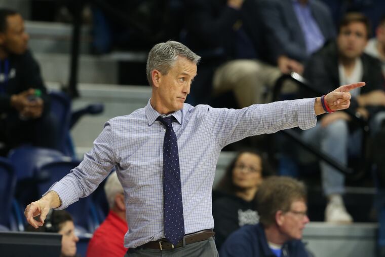 Penn men's basketball coach Steve Donahue directng his team from the Palestra sideline during the March 6 game against Cornell.