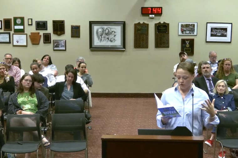 In this video screenshot, Katherine Barrett-Risk, a Radnor graduate, reads an afterword from 'Gender Queer' during a Radnor school board meeting Tuesday. Barrett-Risk was among numerous community members who called on the board to restore three recently banned books to its high school library.