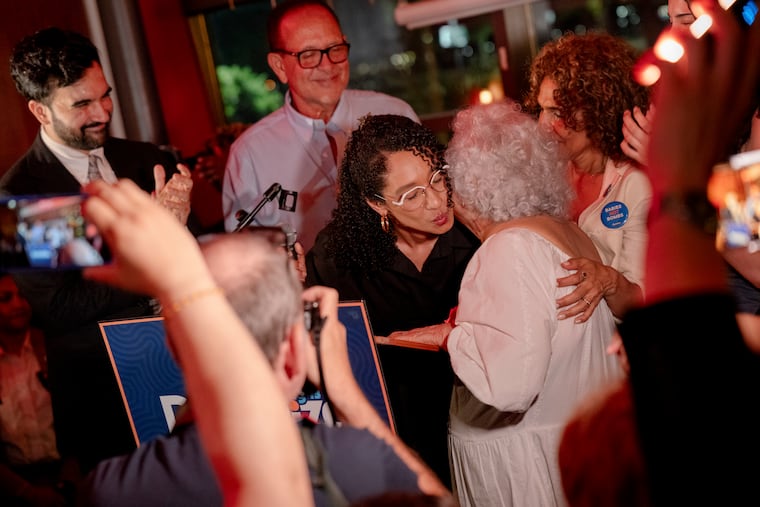 Progressive Democrat Darializa Avila Chevalier, center, alongside Mayor Zohran Mamdani, left, greets supporters at a primary election night gathering in Manhattan last month after defeating the incumbent in New York’s 13th Congressional District, Rep. Adriano Espaillat (D-N.Y.).