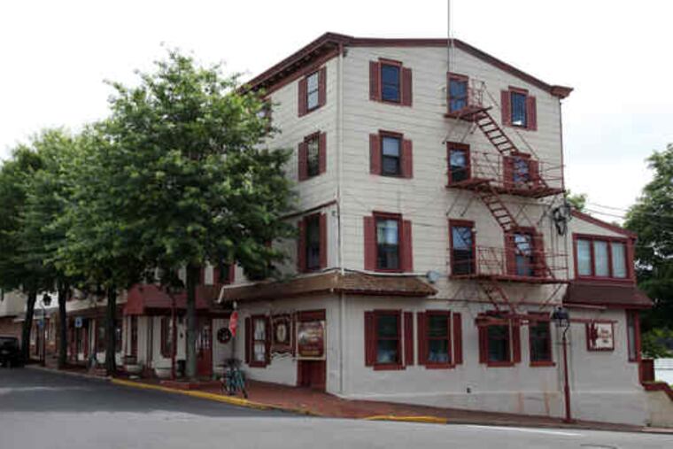 The King George II Inn, once visited by George Washington, closed last month. Its owners, who owe back taxes and are behind in loan payments, have put it up for sale. Photographs below show the Bristol Borough landmark in the 1920s, bottom, and in the 1890s.