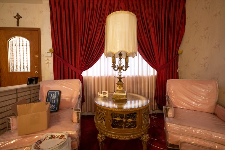 The vintage furniture in this South Philly rowhouse was perfectly preserved by clear vinyl covers.