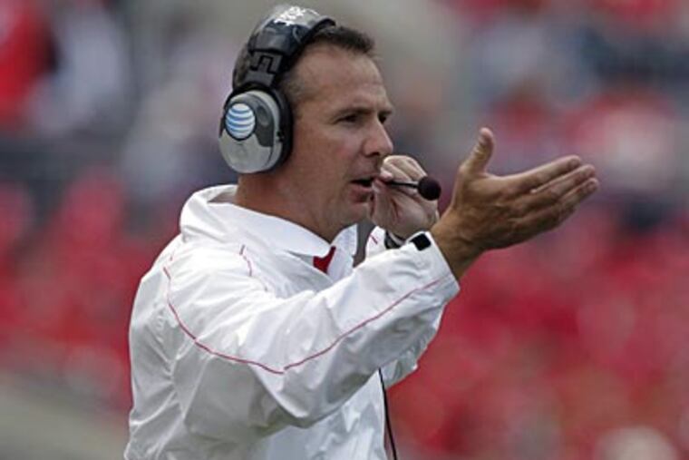 Urban Meyer's Buckeyes are 4-0 on the season and ranked 14th in the AP Top 25. (Jay LaPrete/AP)