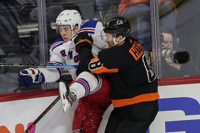 Flyers defenseman Robert Hagg checks the New York Rangers' Jesper Fast during during a Feb. 28 game at the Wells Fargo Center.