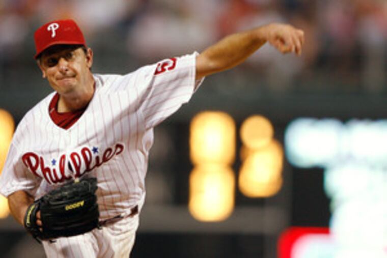 Lefthander Jamie Moyer delivers a pitch against the Reds. He took a no-hitter into the sixth and had a 3-0 lead in the seventh. But he ran into trouble, and the bullpen failed to come through.