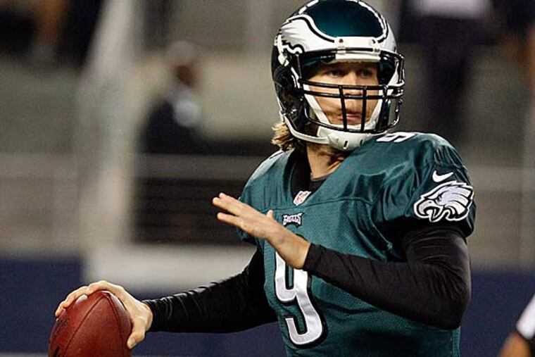 Eagles quarterback Nick Foles passes the ball against the Cowboys during the first half. (LM Otero/AP)