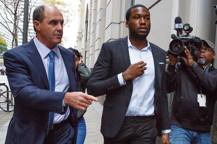 Rapper Meek Mill, center, arrives at the Criminal Justice Center in Philadelphia with his lawyer Brian McMonagle, on Monday, Nov. 6, 2017.