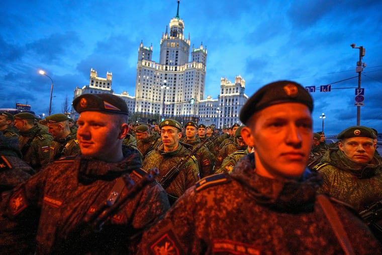 Russian servicemen prepare to march toward Red Square prior to Wednesday's Victory Day military parade rehearsal in Moscow.