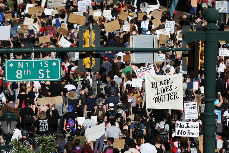 Protesters calling to defund the police marched down East Market Street near Eighth Street in Center City Philadelphia on June 13. Rank and file union members have joined these protests, but many labor officials do not support protesters' calls to defund the police.